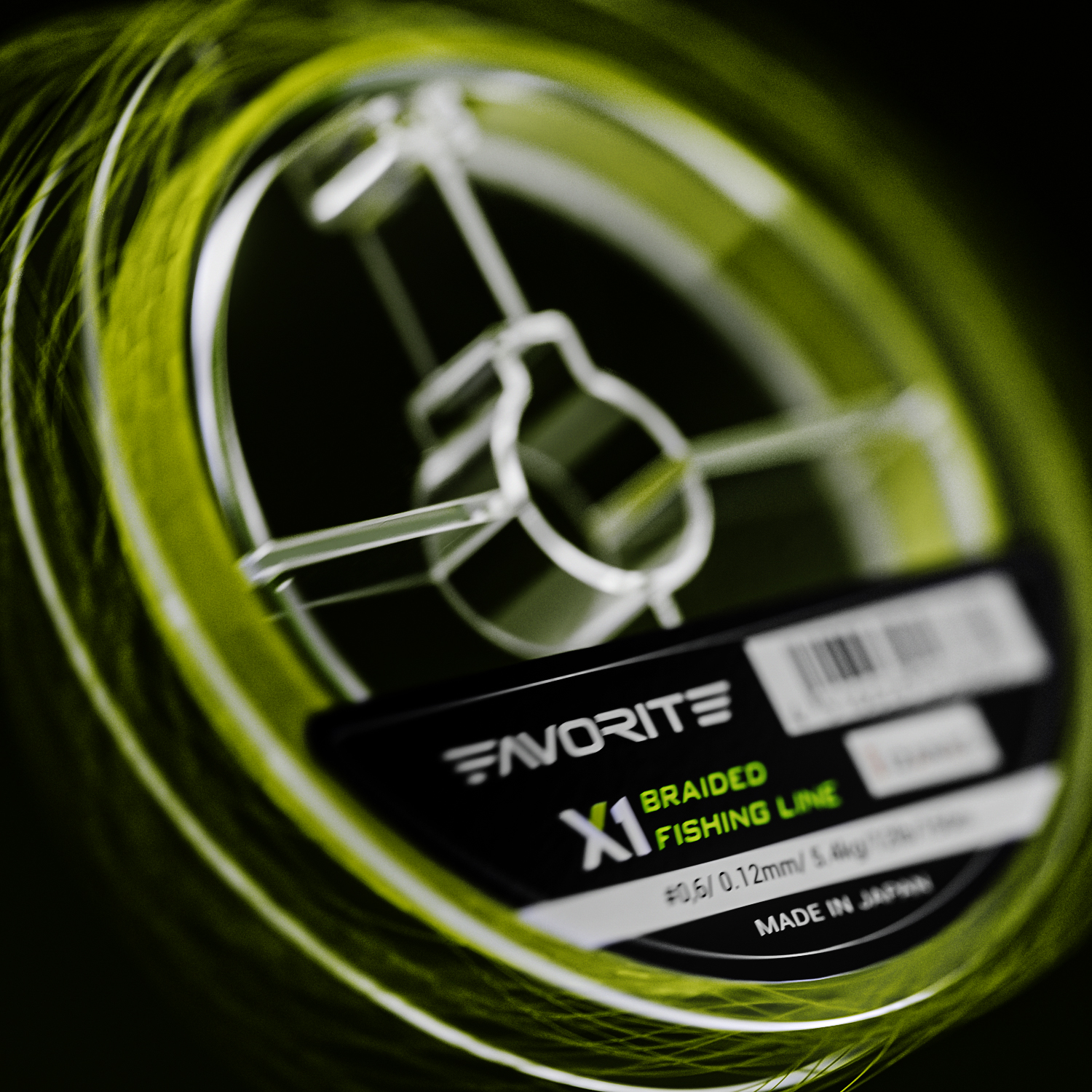 Lime fishing braid wound around a transparent Favorite spool
